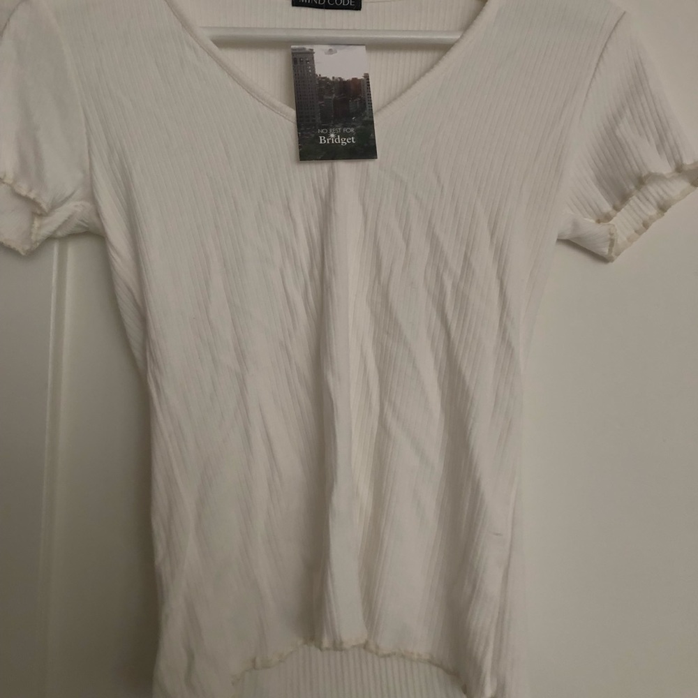 White V-neck top
